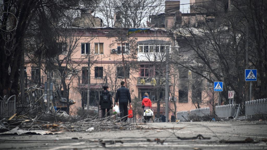 Civilians walking in Mariupol.