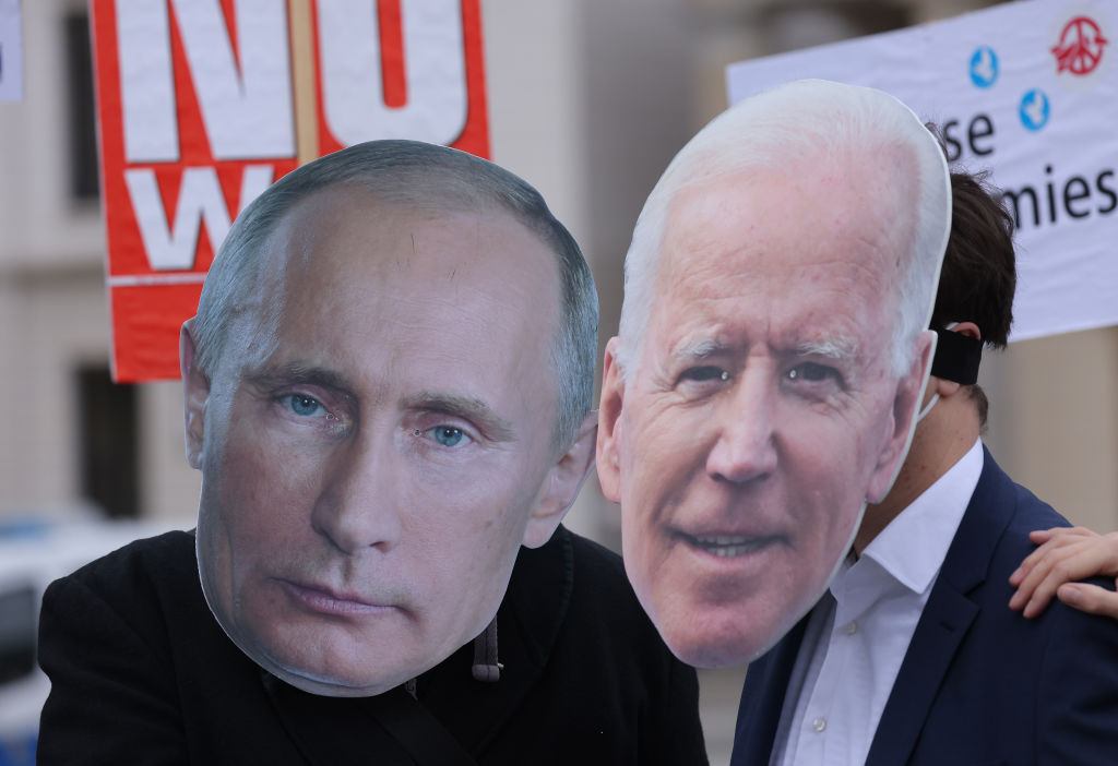 Putin and Biden cardboard cutouts.