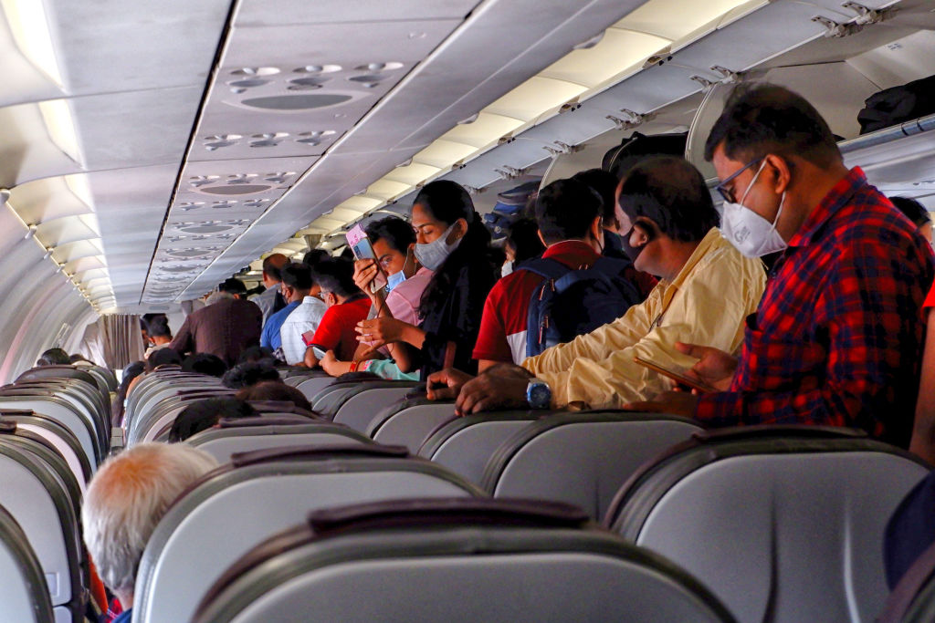 Airplane passengers wearing masks