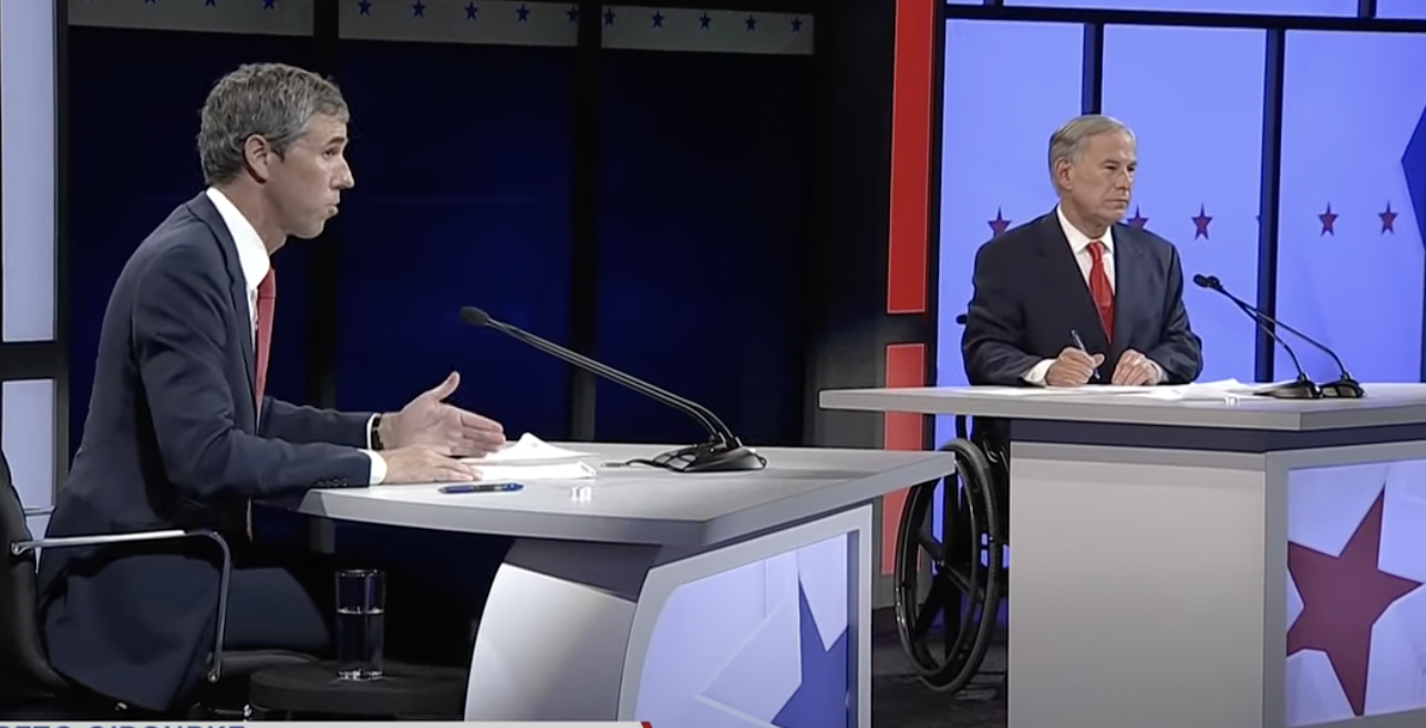 Beto O&#039;Rourke and Gov. Greg Abbott face each other during a debate. 