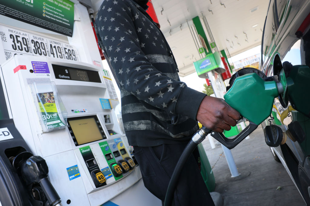 person using gas pump photo