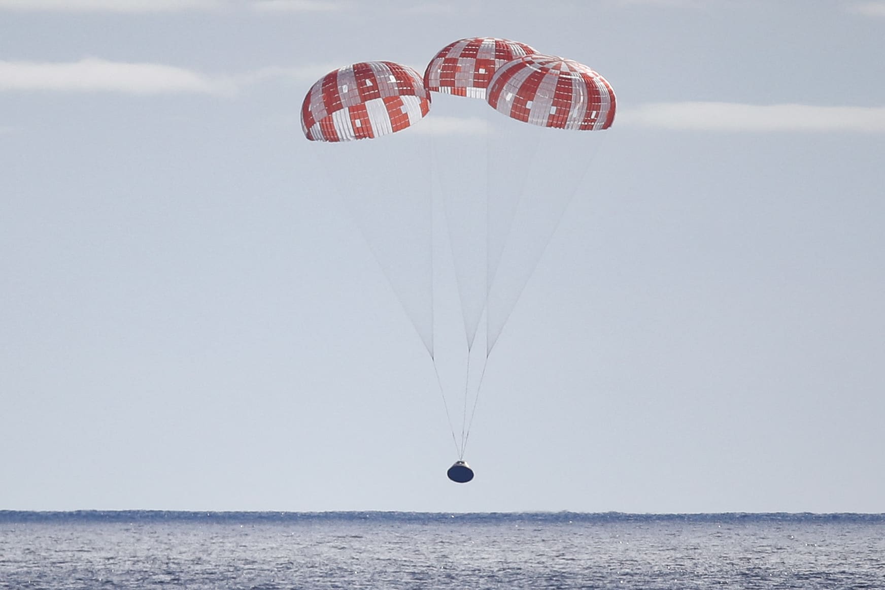 NASA&#039;s unmanned Orion spacecraft splashes down in the Pacific Ocean.