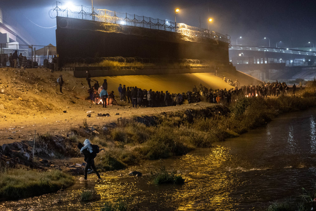 Immigrants cross the Rio Grande into El Paso, Texas