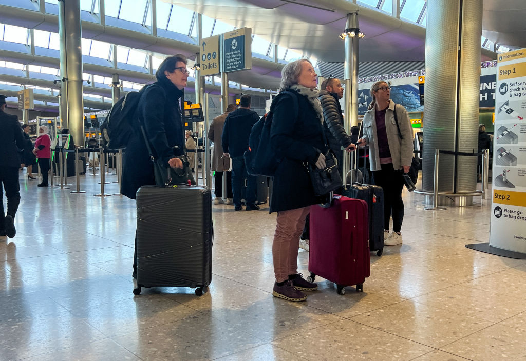 Passengers waiting at Heathrow Airport in London.