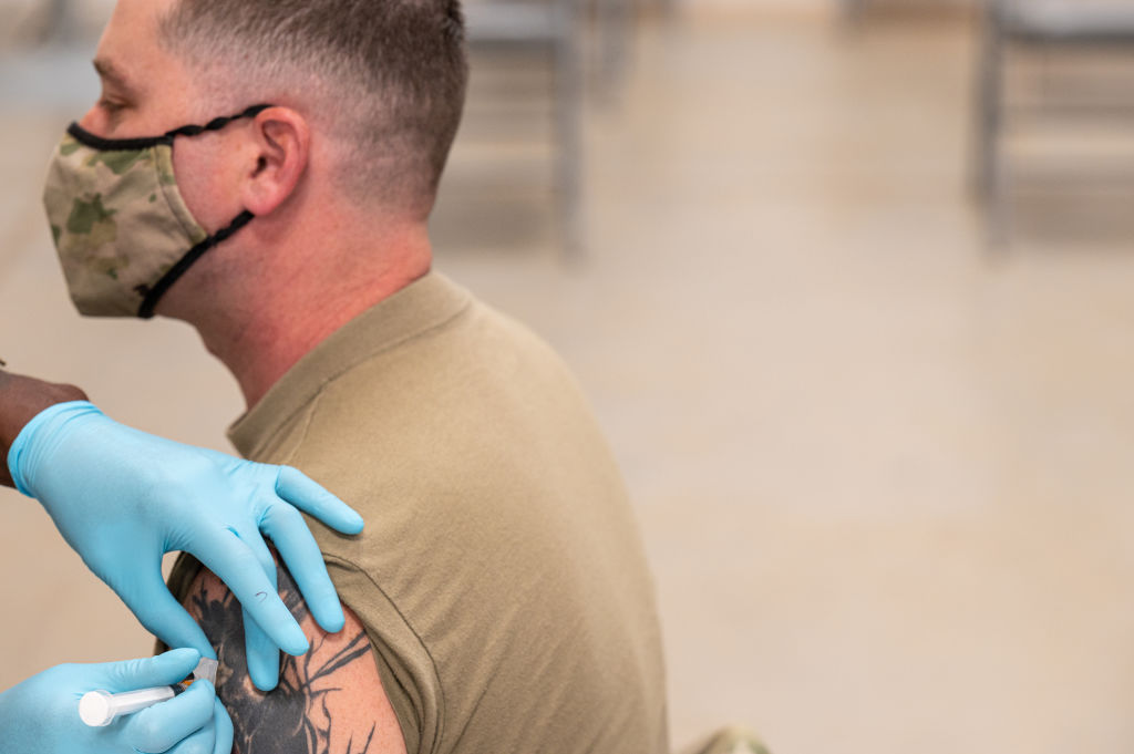  A soldier receives a COVID-19 vaccine from Army Preventative Medical Services  in Fort Knox, Kentucky.