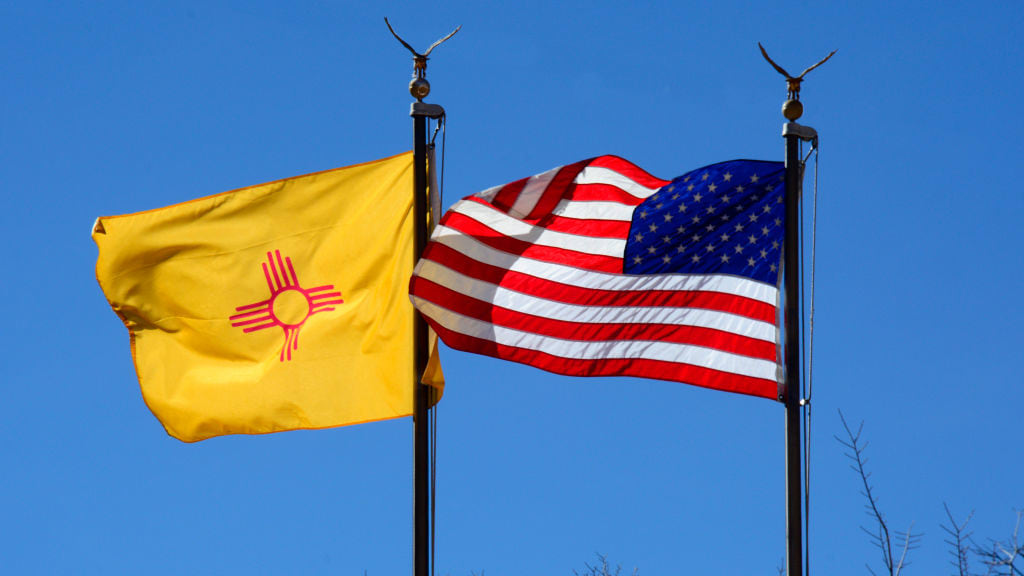 The New Mexico and U.S. flags.