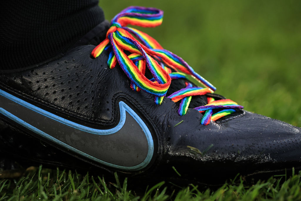 Cleat with rainbow shoelaces