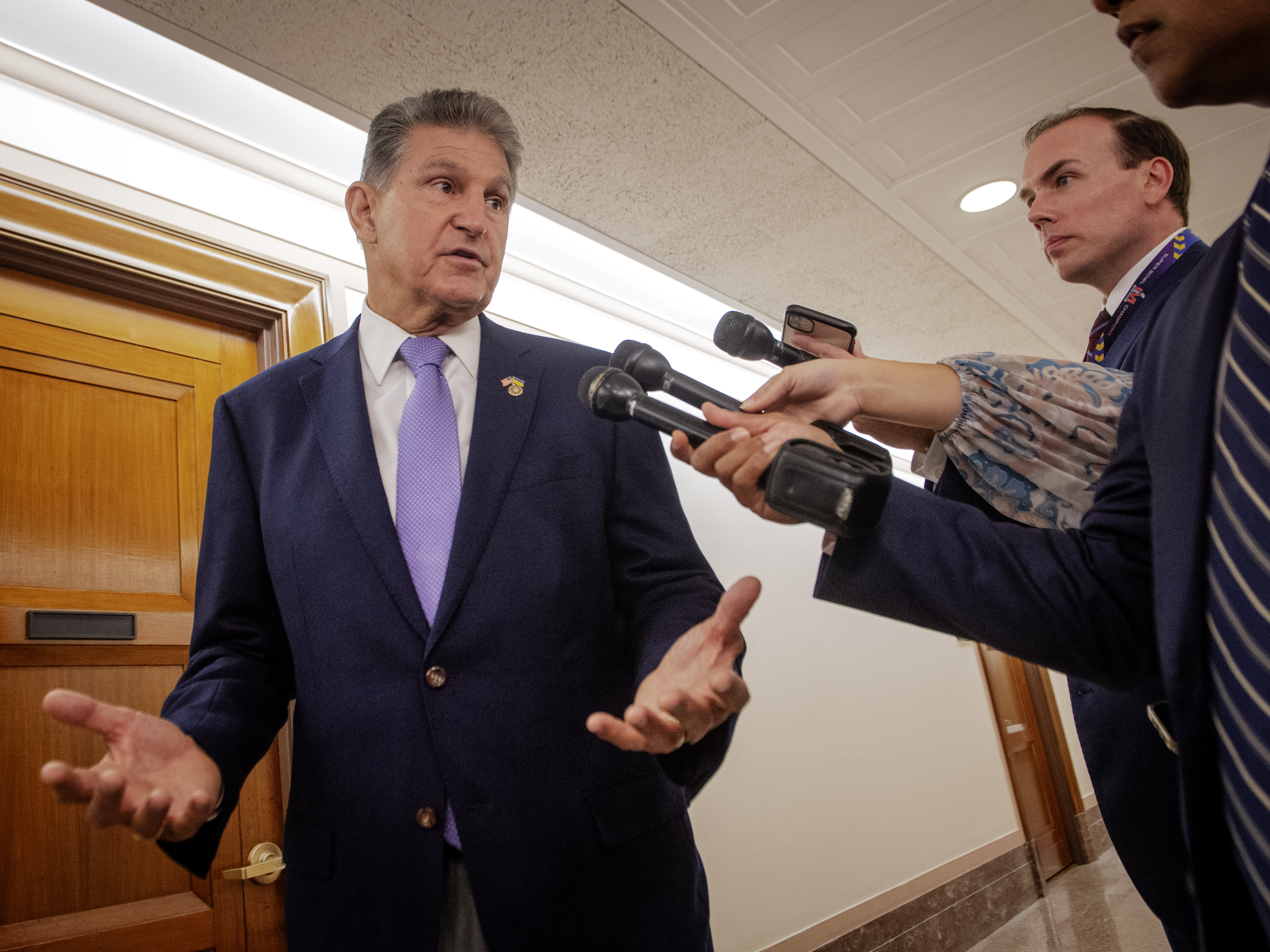Sen. Joe Manchin stands outside a Energy and Natural Resources committee hearing earlier this month
