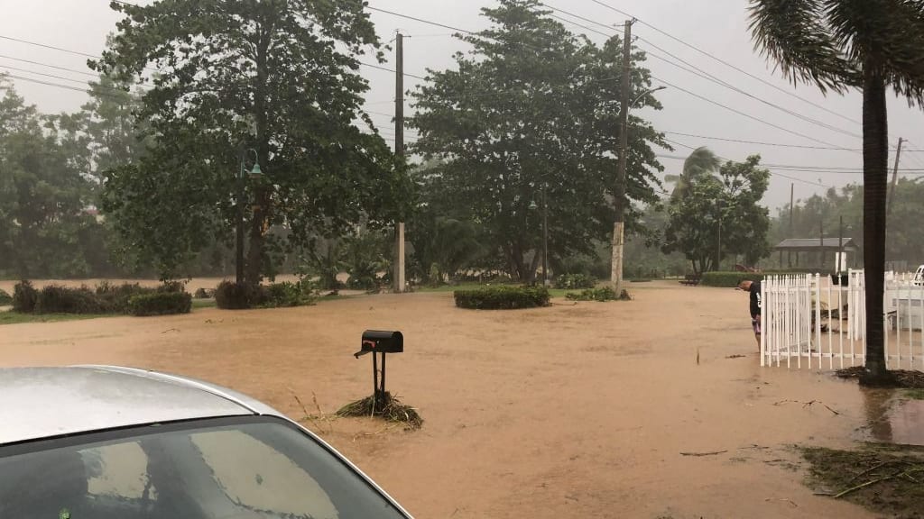 A flooded road in Villa Blanca, Puerto Rico