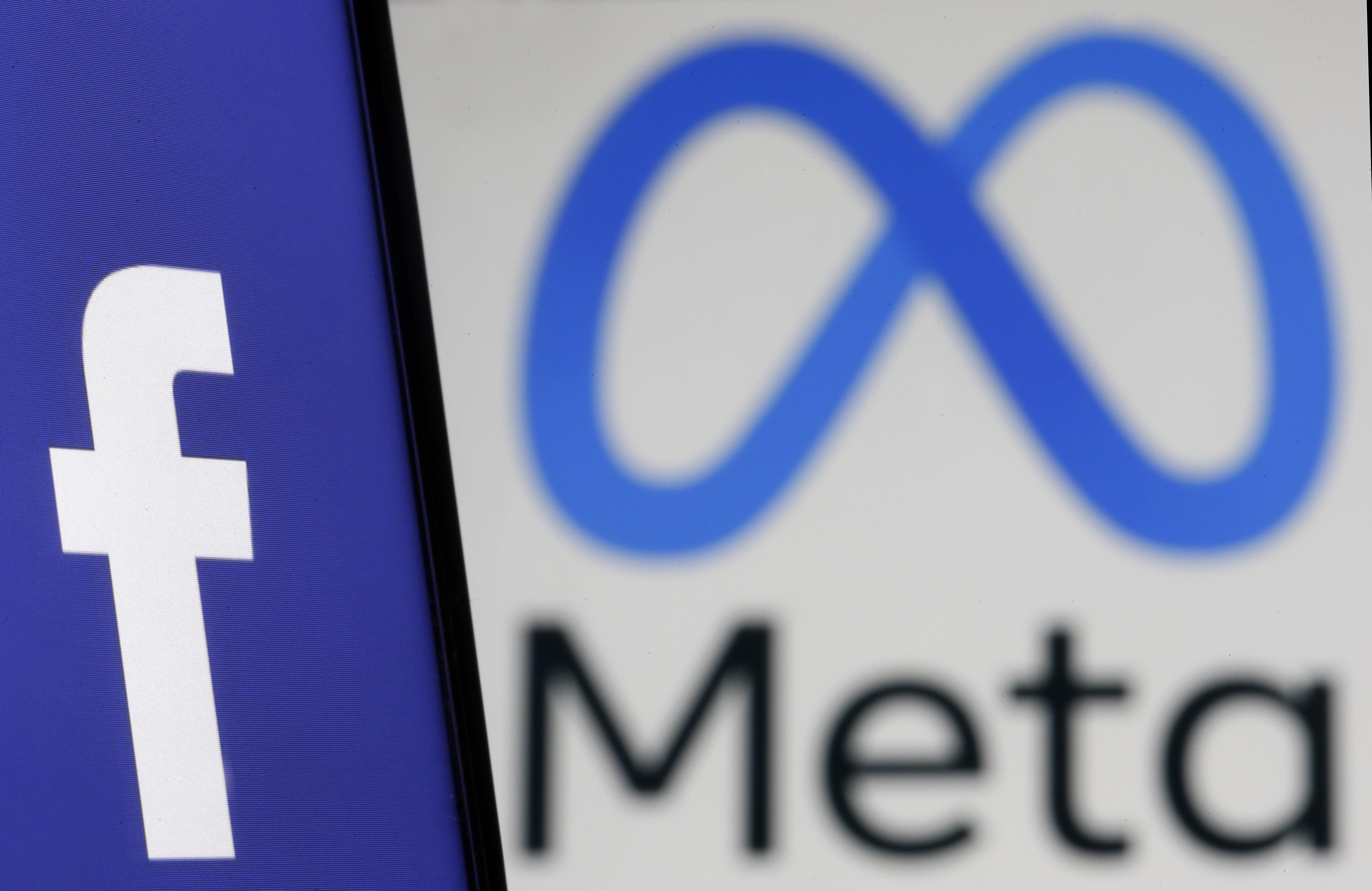 Illustration of Meta logo and Facebook logo
