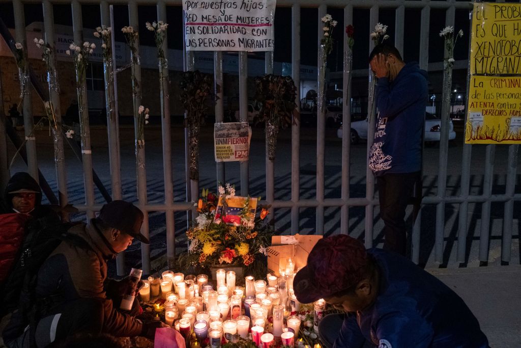 Mourners outside migrant center in Ciudad Juarez, Mexico