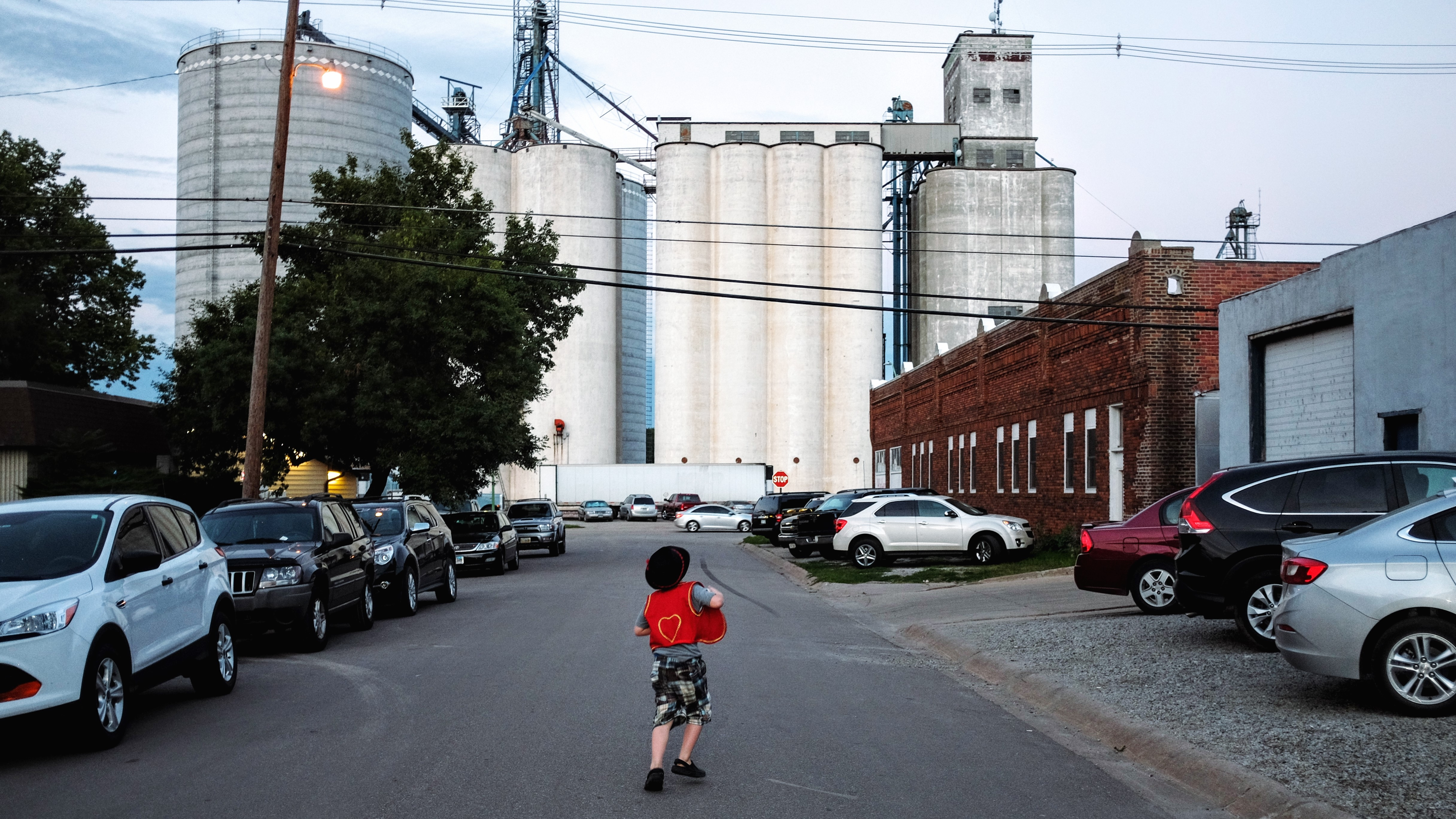 child running toward factory