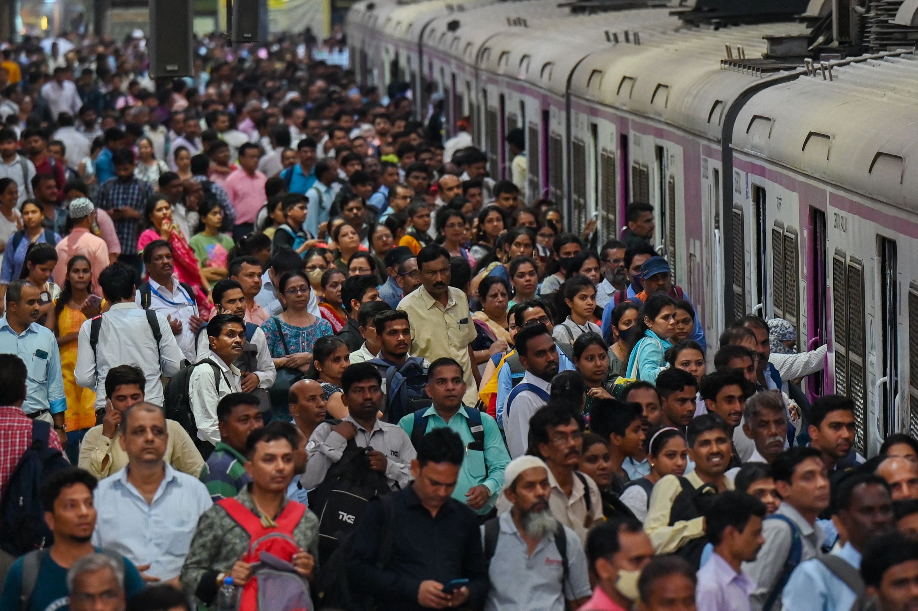 People crowd on platforms at the Chhatrapati Shivaji Terminus railway station in Mumbai