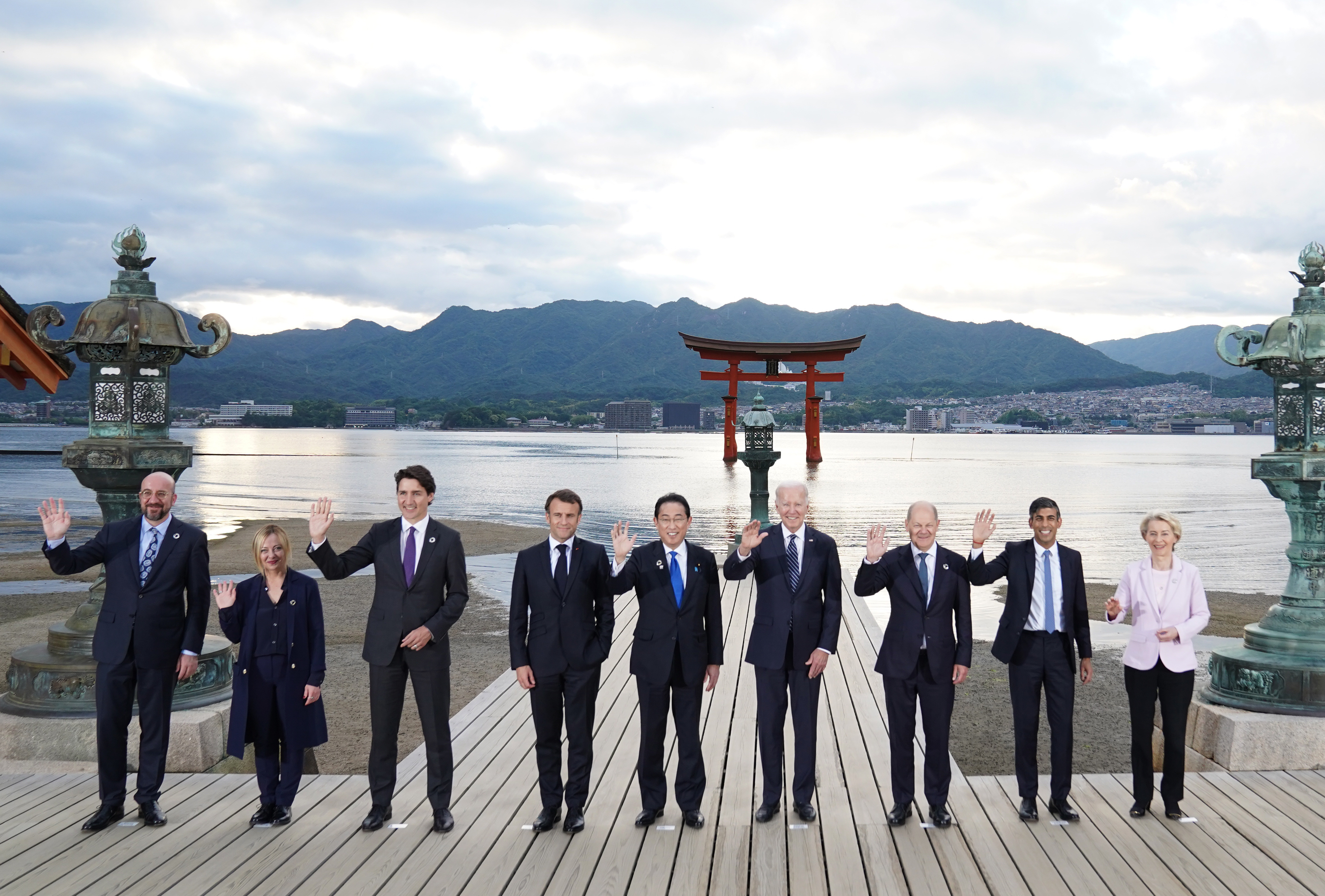 G7 pose for the family photo at the Itsukushima Shrine 