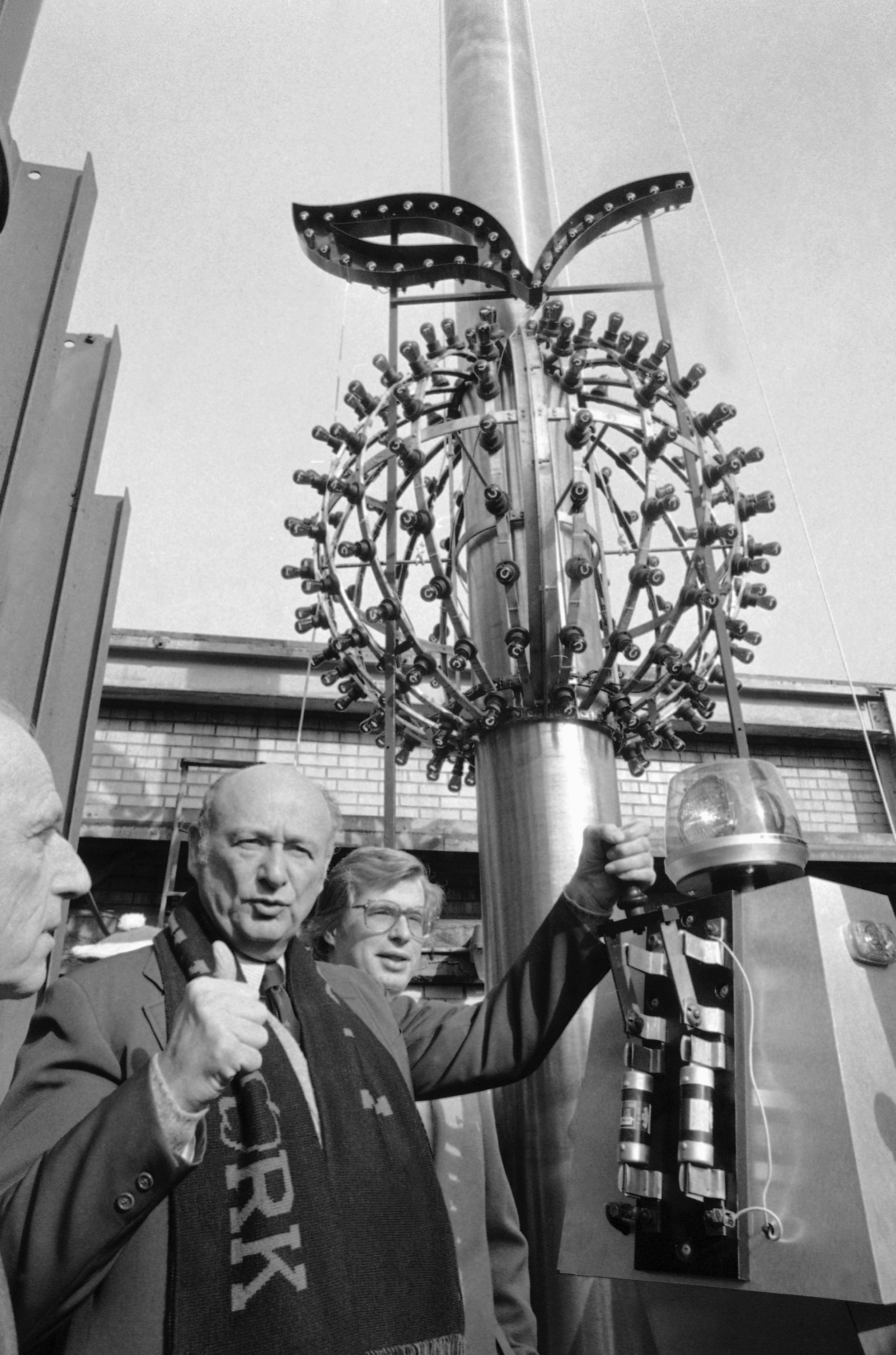 Mayor Ed Koch gives the thumbs up sign as he flips a switch to test the Big Apple Ball, Thursday, Dec. 24, 1981 in New York